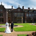 Somerset wedding photography od bride and groom in front of St Audries near Minehead