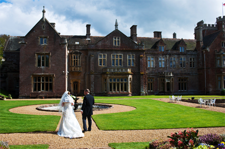 Somerset wedding photography od bride and groom in front of St Audries near Minehead