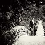 Wedding couple photographed on the bridge in the grounds of Bovey Castle