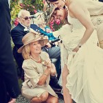 Wedding photographer at Bovey Castle captures bride and mums adjusting her garter.