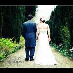 Bride andf groom walking in the gardens of Endsleigh Hotel on their wedding day