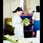 Bride getting ready Hotel Endsleigh wedding - looking at bouquet