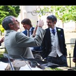 Guest taking photograph at Somerset church wedding.