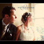 Bride and groom looking out of the staircase window at Haldon Belvedere wedding near Exeter