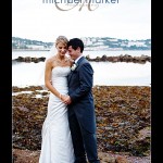 Bride and groom at Torquay wedding with sea in background