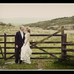 Bride and groom in gateway at Two Bridges Hotel wedding