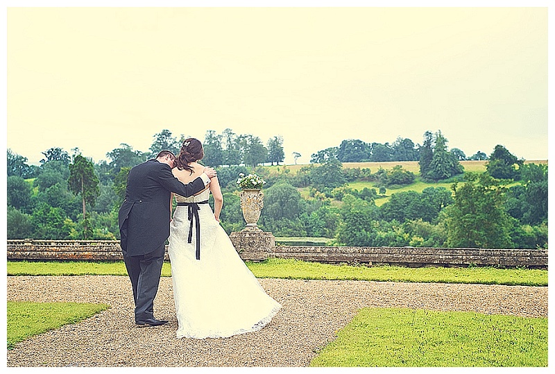 Bride and groom in the gardens of Orchardleigh House during wedding 