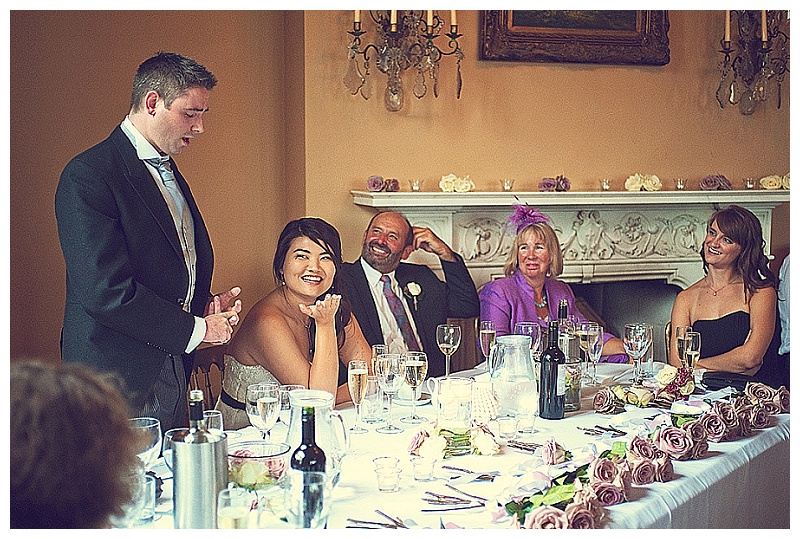 Wedding specches at orchardleigh House wedding - bride looking at groom