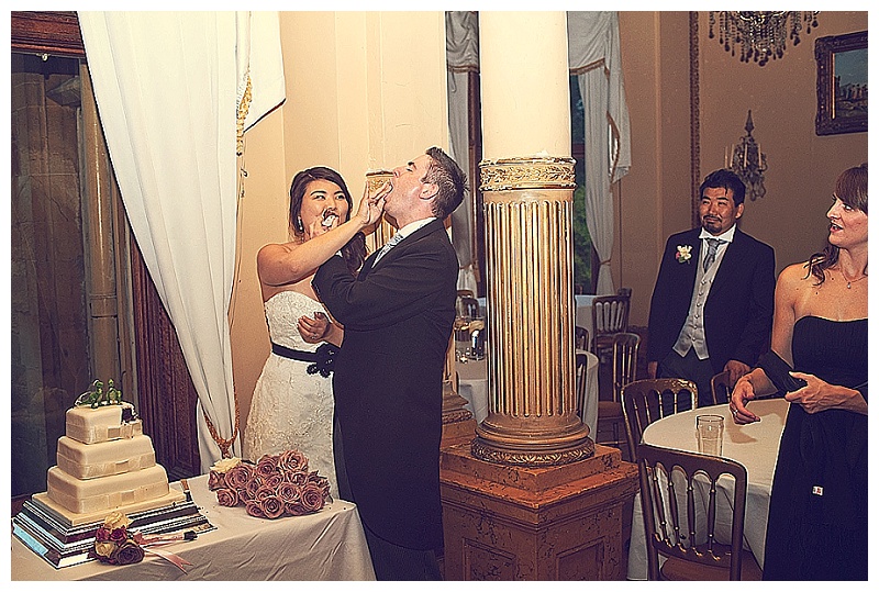 Bride and groom cutting the cake at Orchardleigh House 