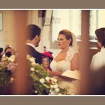 Bride and groom exchanging vows and rings at Devon Church wedding