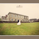 Bride and groom in front of beautiful wedding venue Shilstone House in Devon