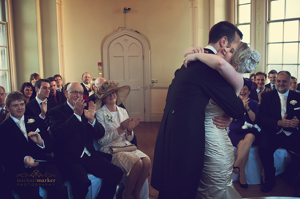 Bride and groom hug during Devon ceremony at Haldon Belvedere