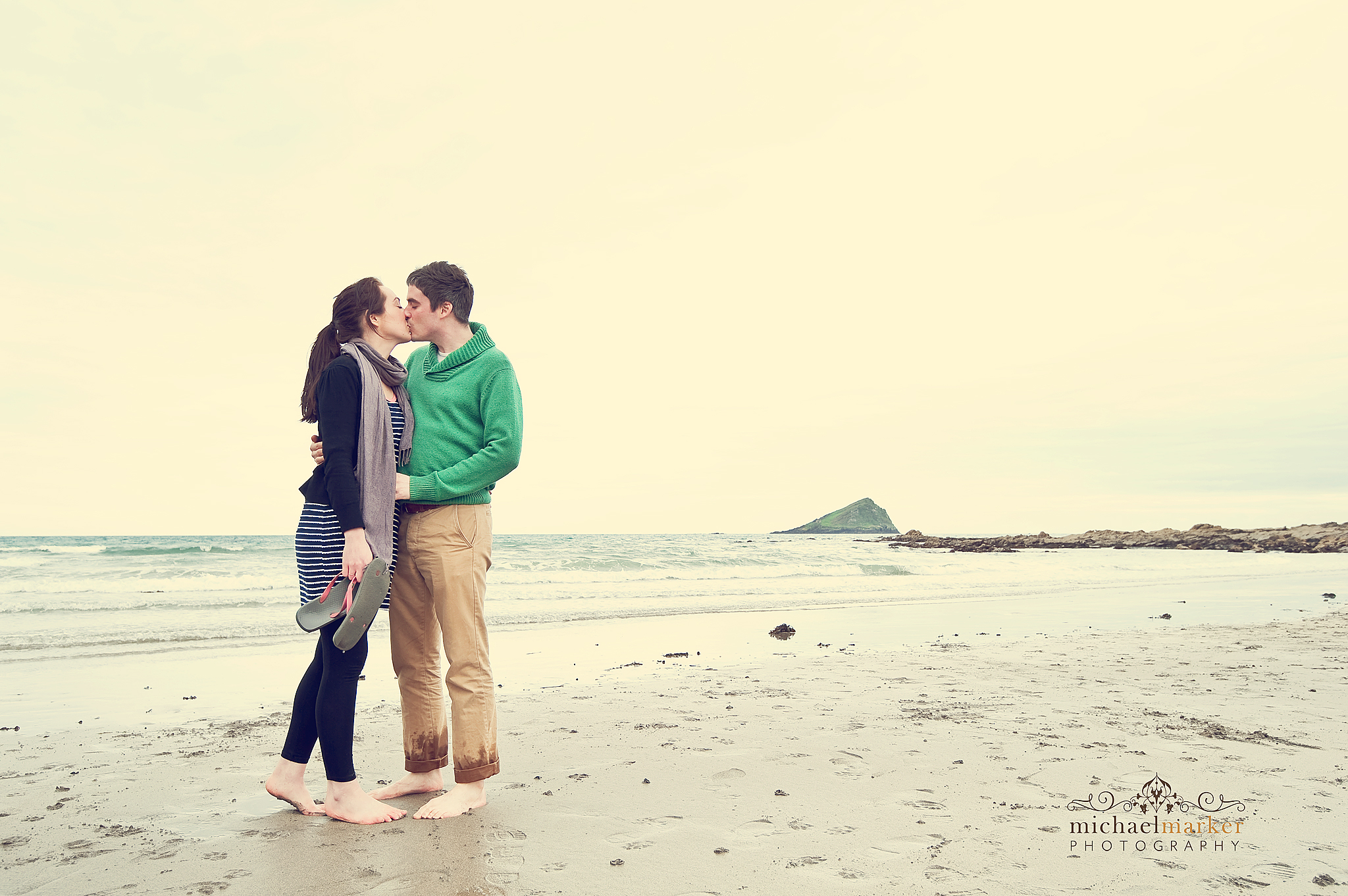 Couple kissing on Wembury beach engagement shoot