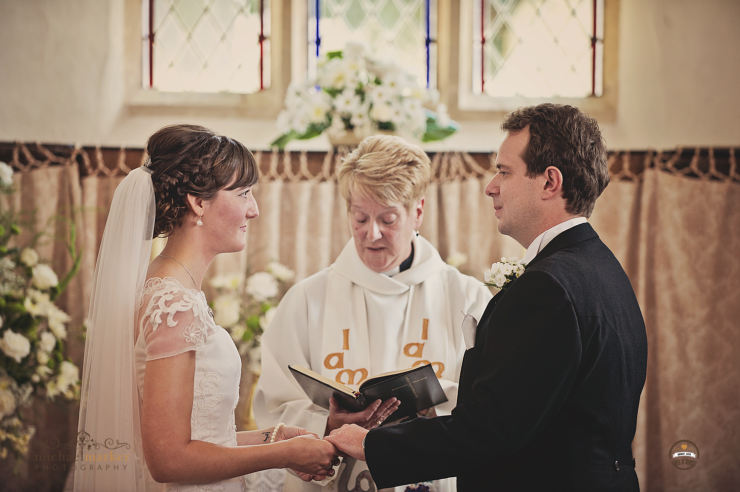 Exchaning wedding vows at Devon chapel wedding