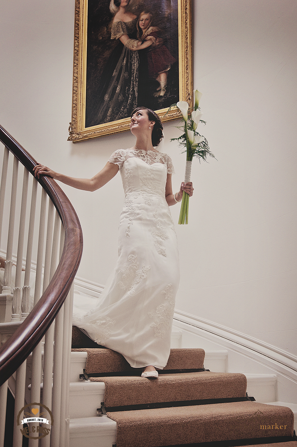 Bride on the stairs at Hallsannery wedding Devon