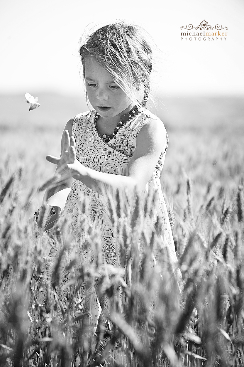 Black and white kids portrait photography in corn field