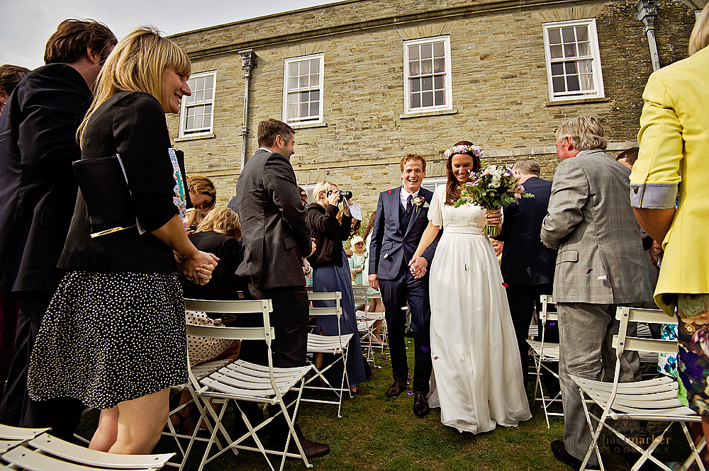 Bride and groom leaving ceremony at Shilstone House wedding