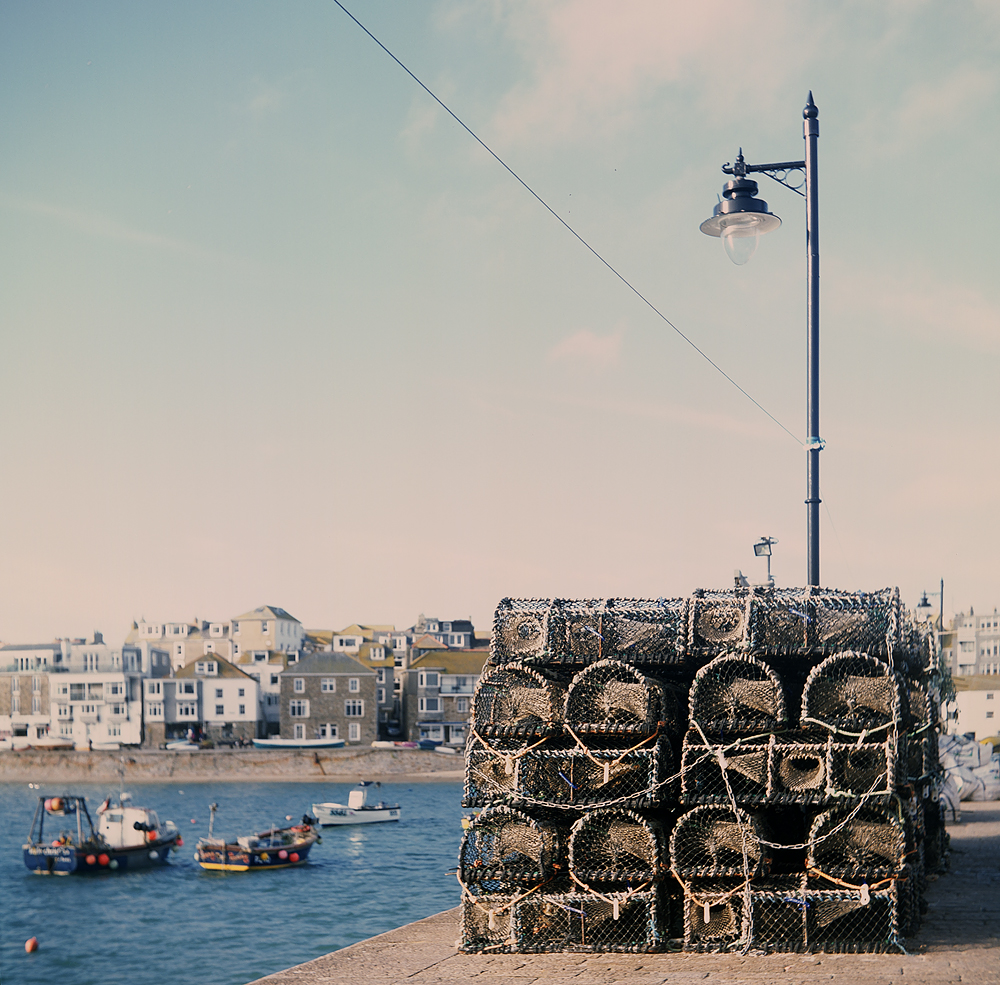 Lobster pots, boats and St Ives in Cornwall