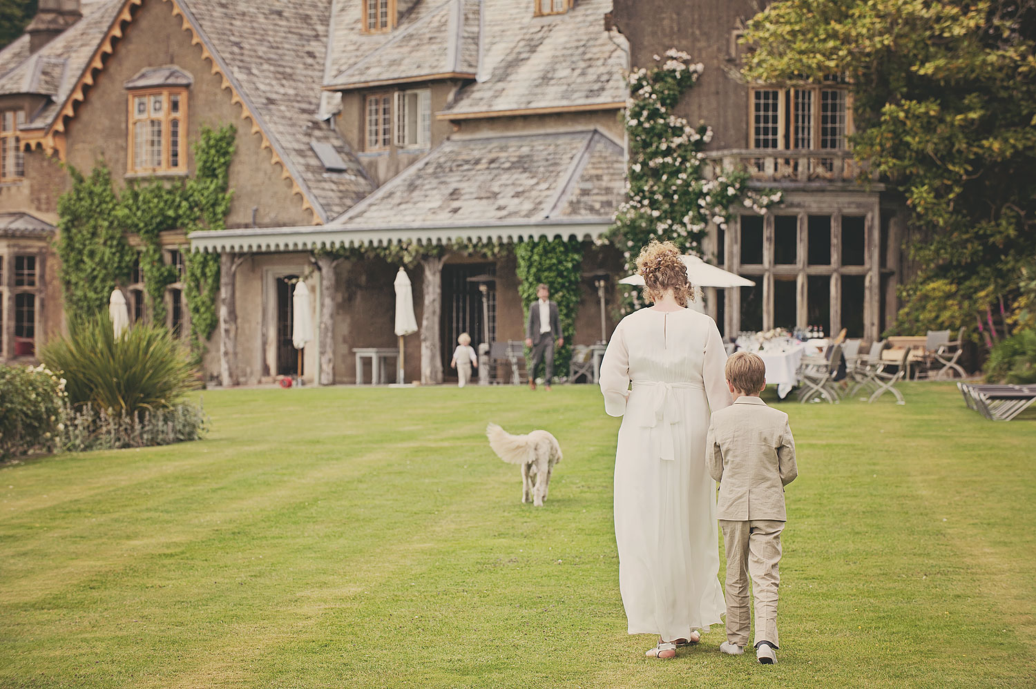 Bride and page boy on terrace at Hotel Endsleigh in Devon.