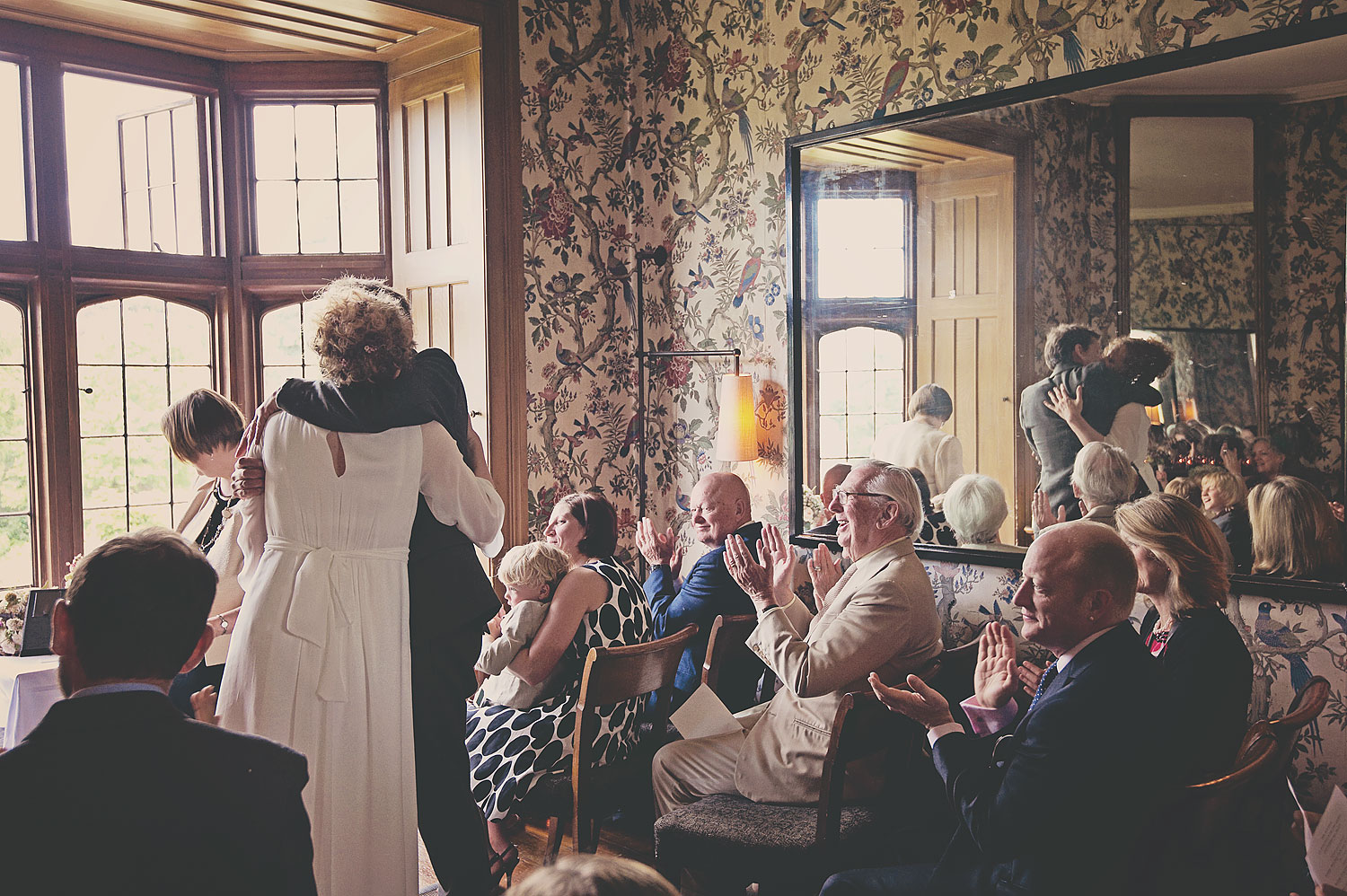 Bride and groom kiss during wedding ceremony at Hotel Endsleigh in Devon