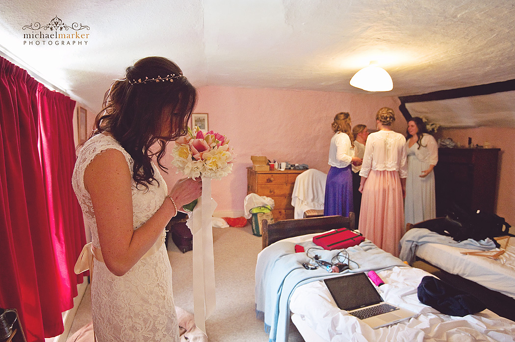 bride smells her fragrant wedding bouquet.