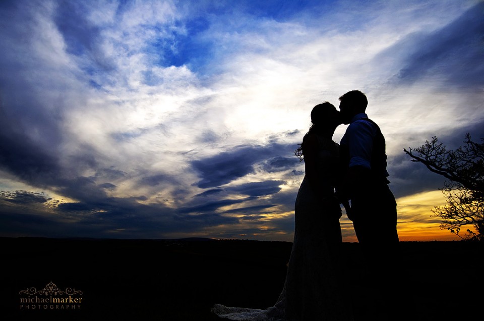 Higher Eggbeer wedding sunset silhouette kiss by bride and groom.