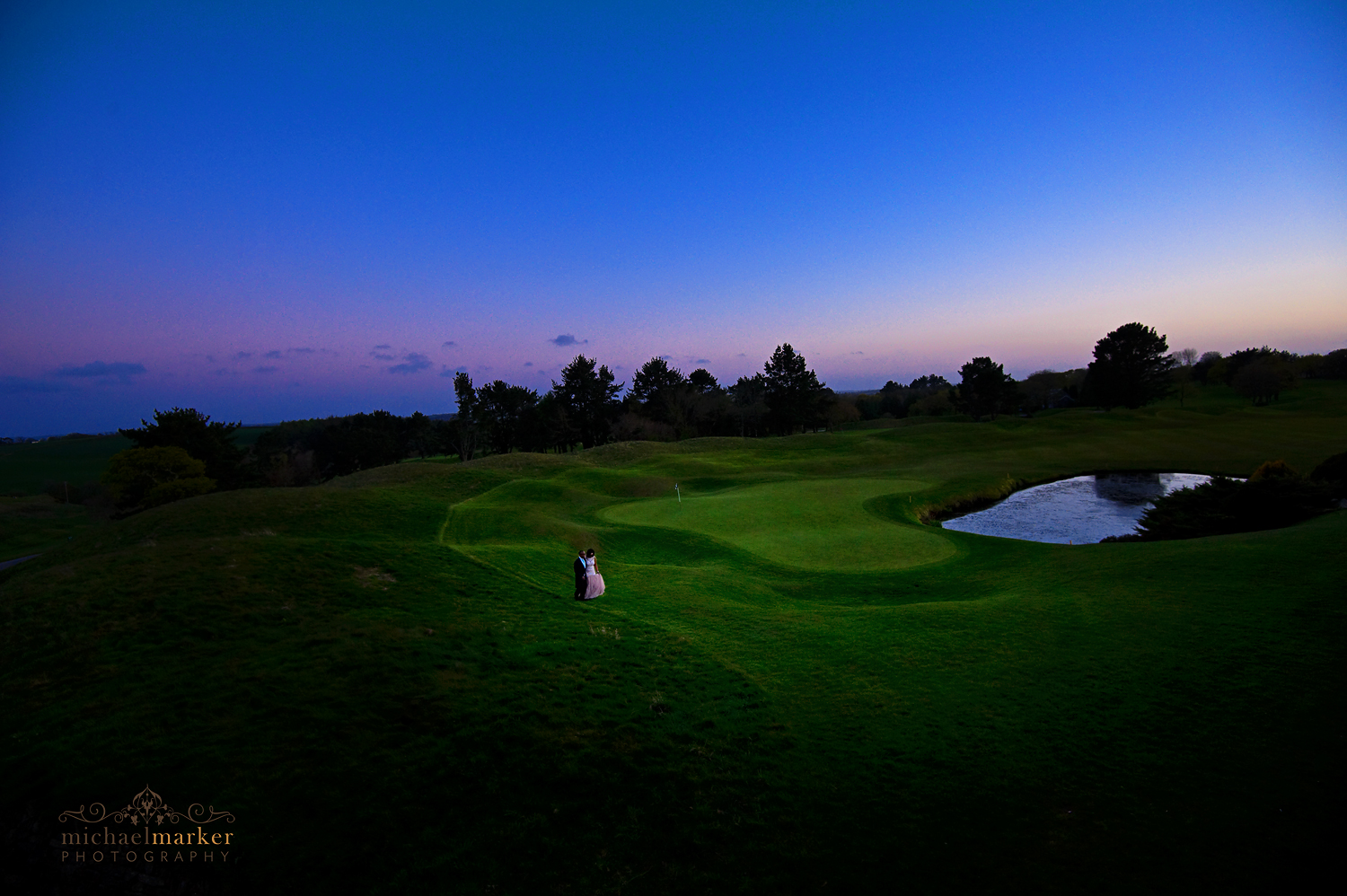 Bride and groom on 18th hole at St Mellion wedding