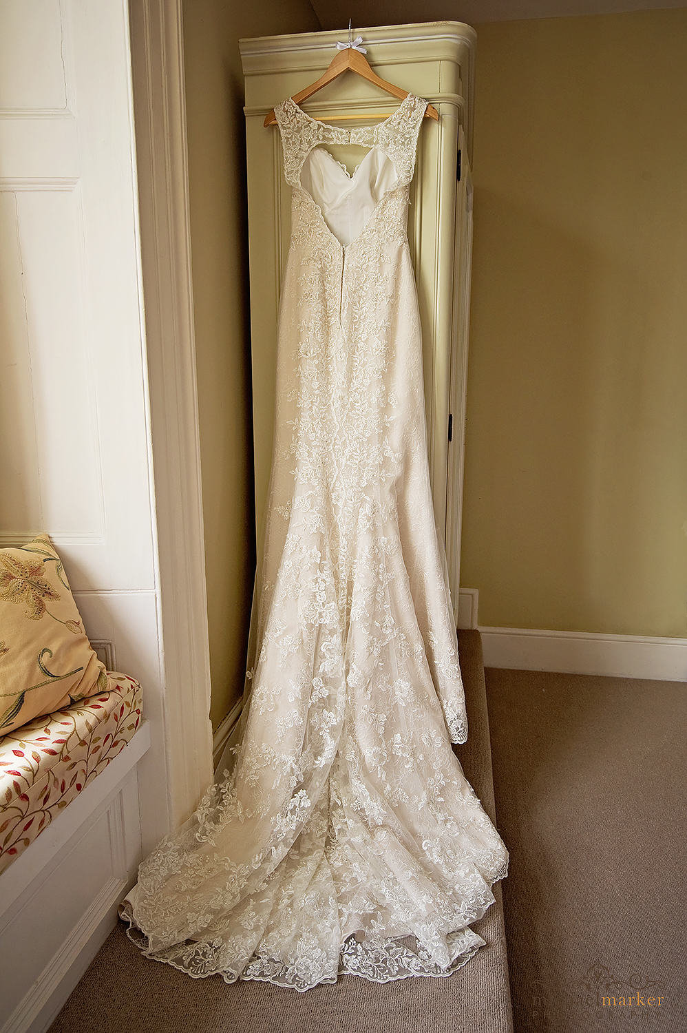 Beautiful lace wedding dress hanging up