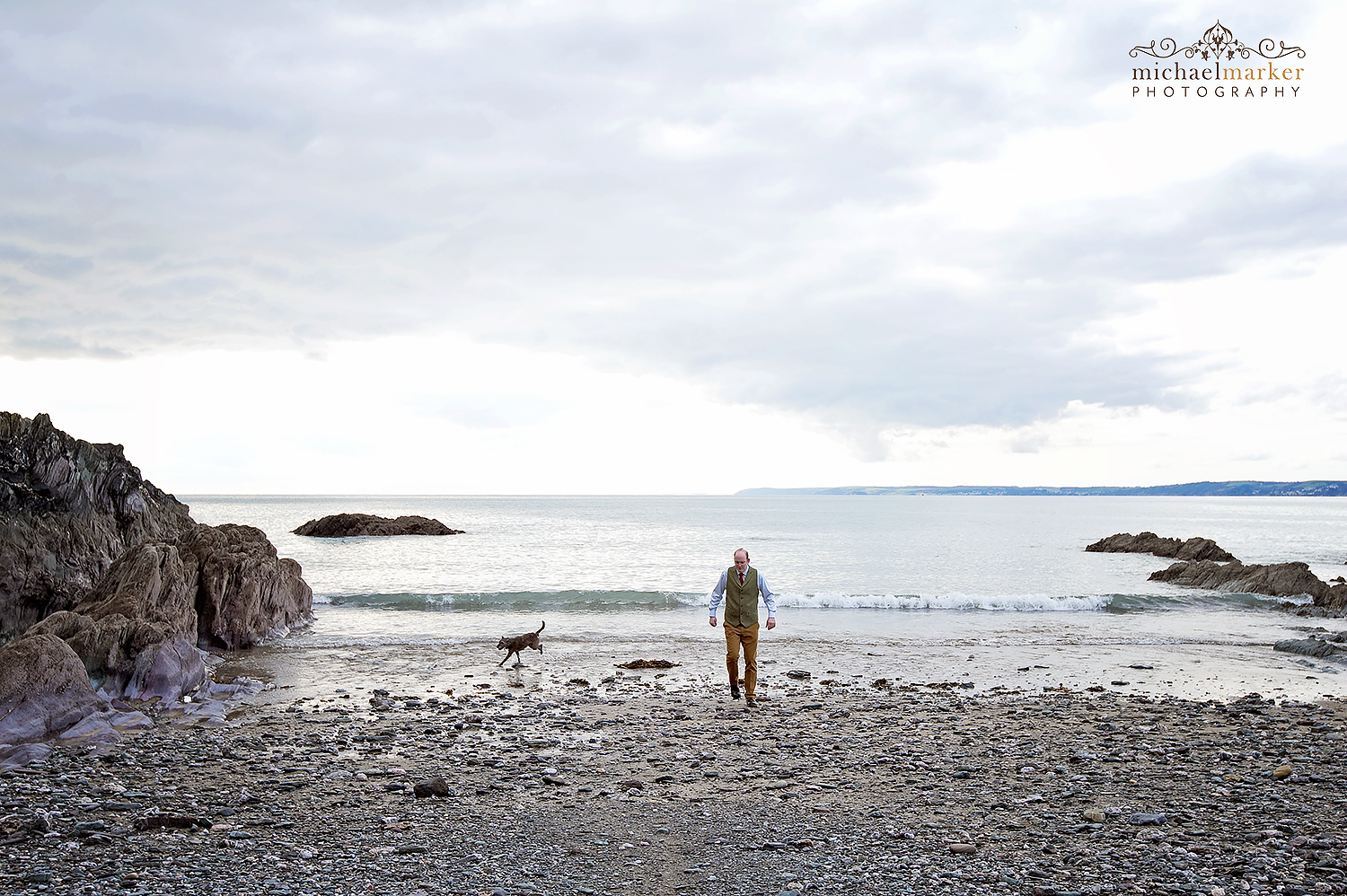 groom-and-dog-on-polhawn-beach