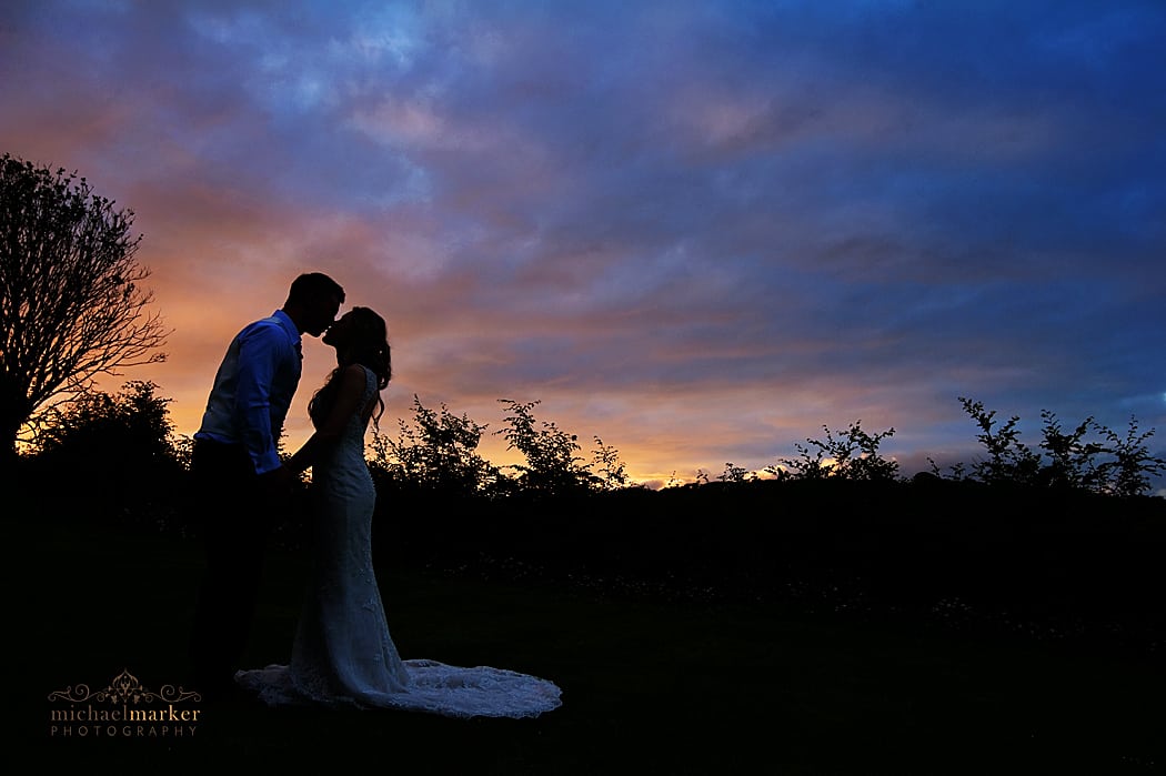 langdon-court-wedding-sunset-kiss