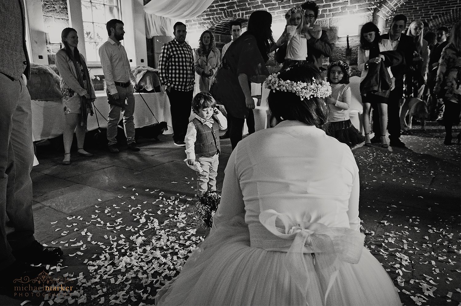 Bride and pageboy inside Polhawn in black and white