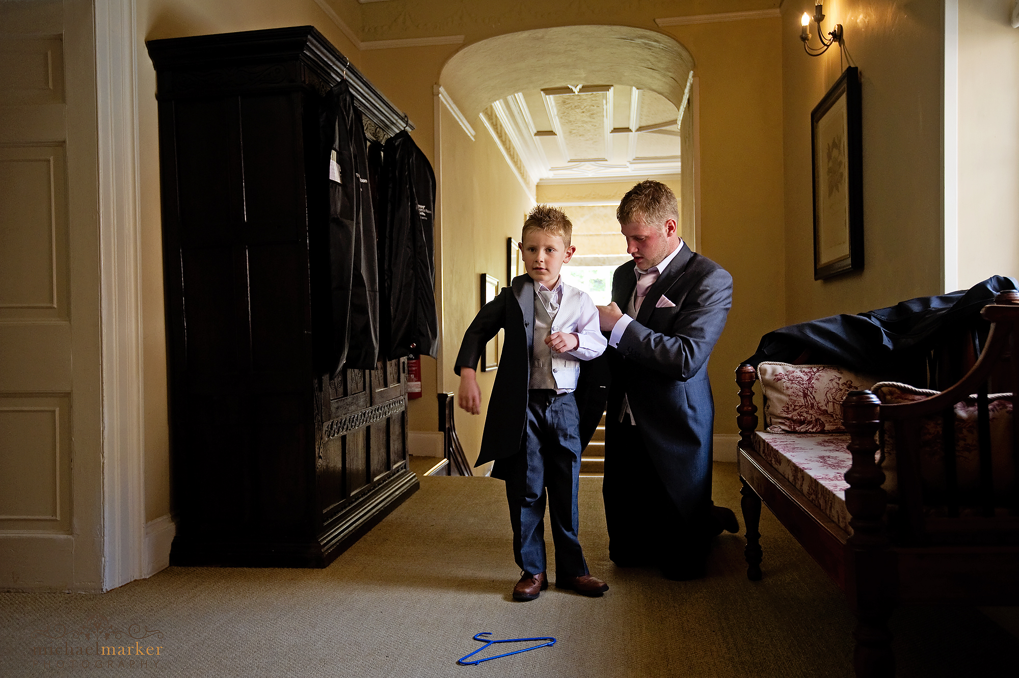 Page boy getting ready at Langdon court hotel devon