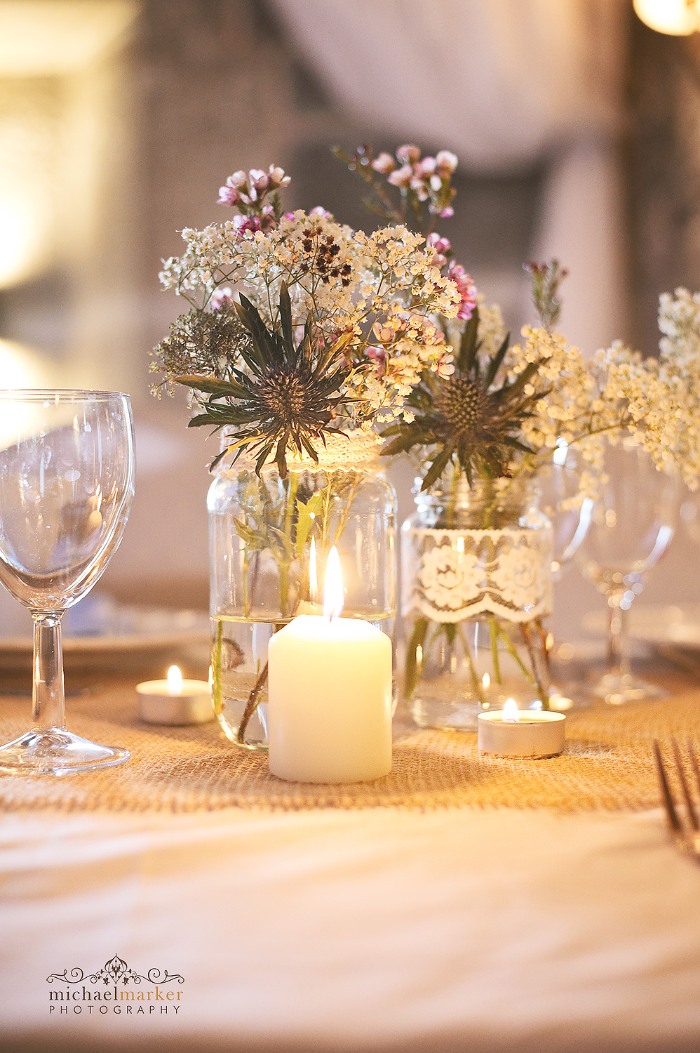 Country flower wedding table centre in jars