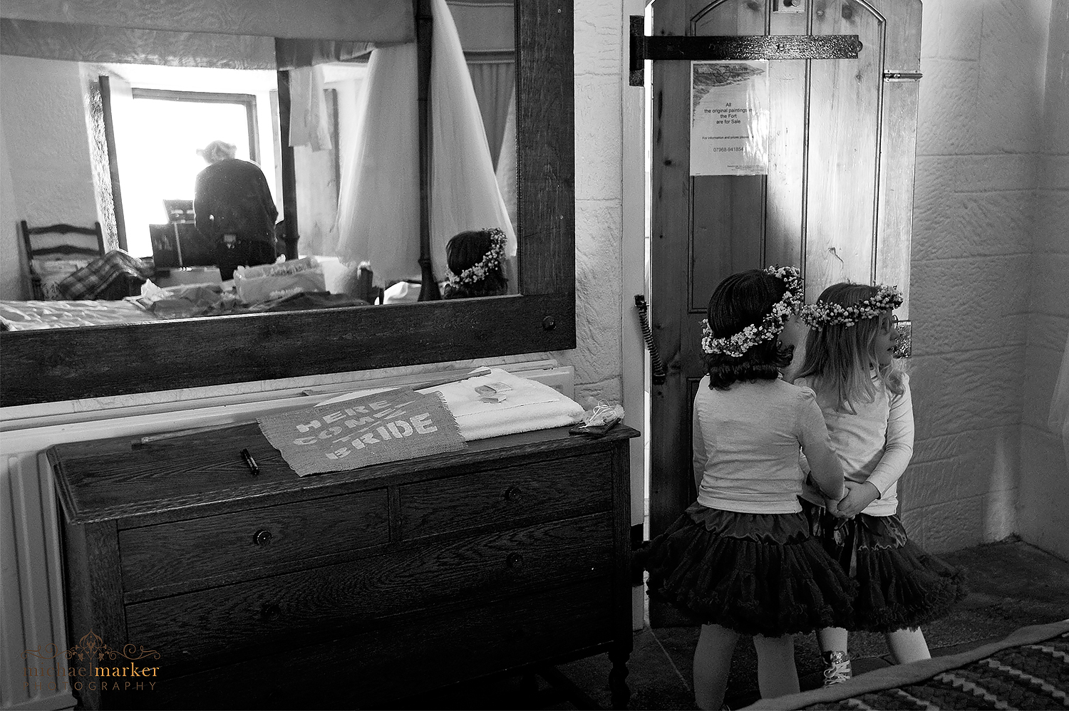 two flower girls playing in bride's room