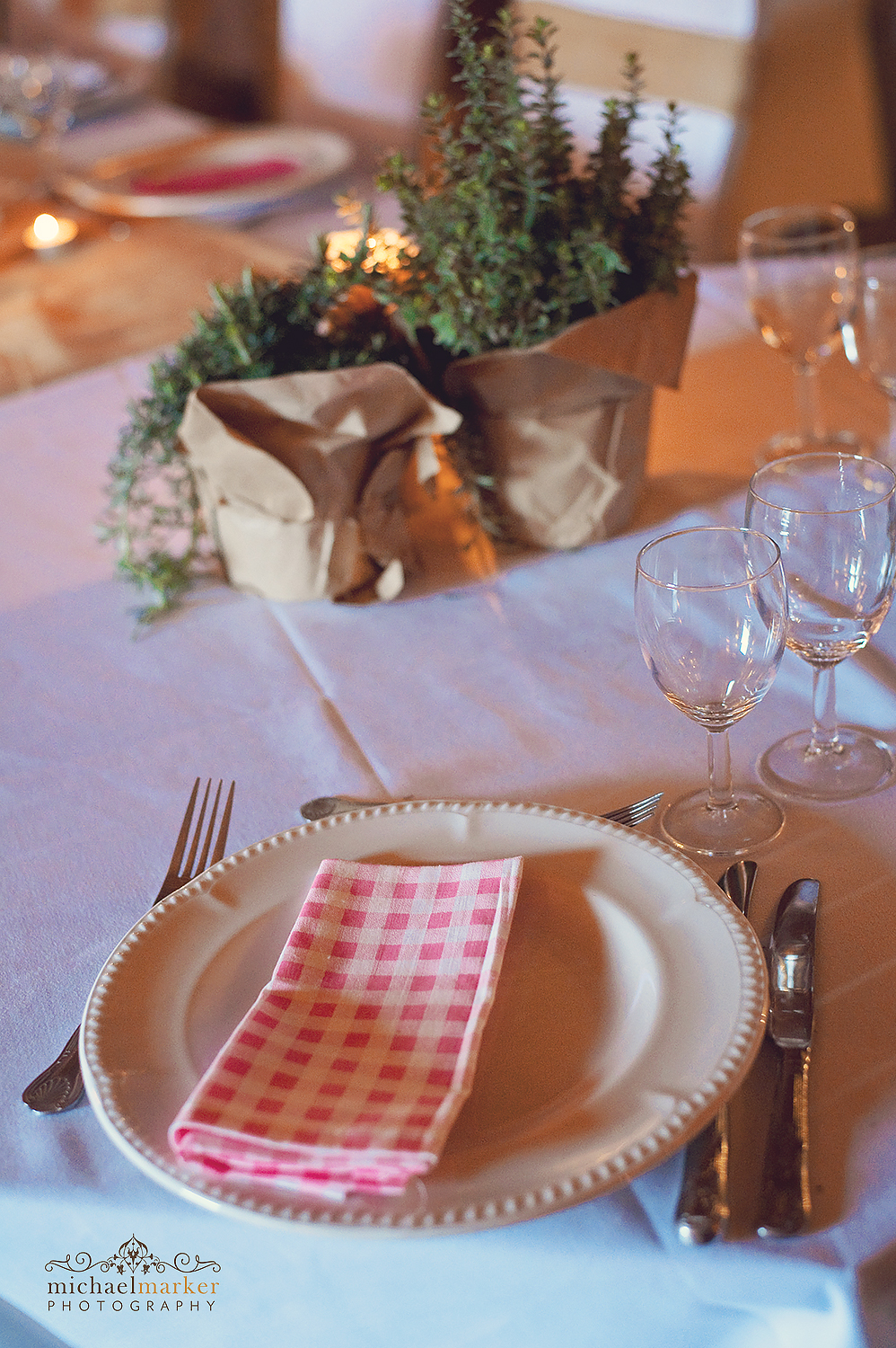 red gingham place setting and herb decoration