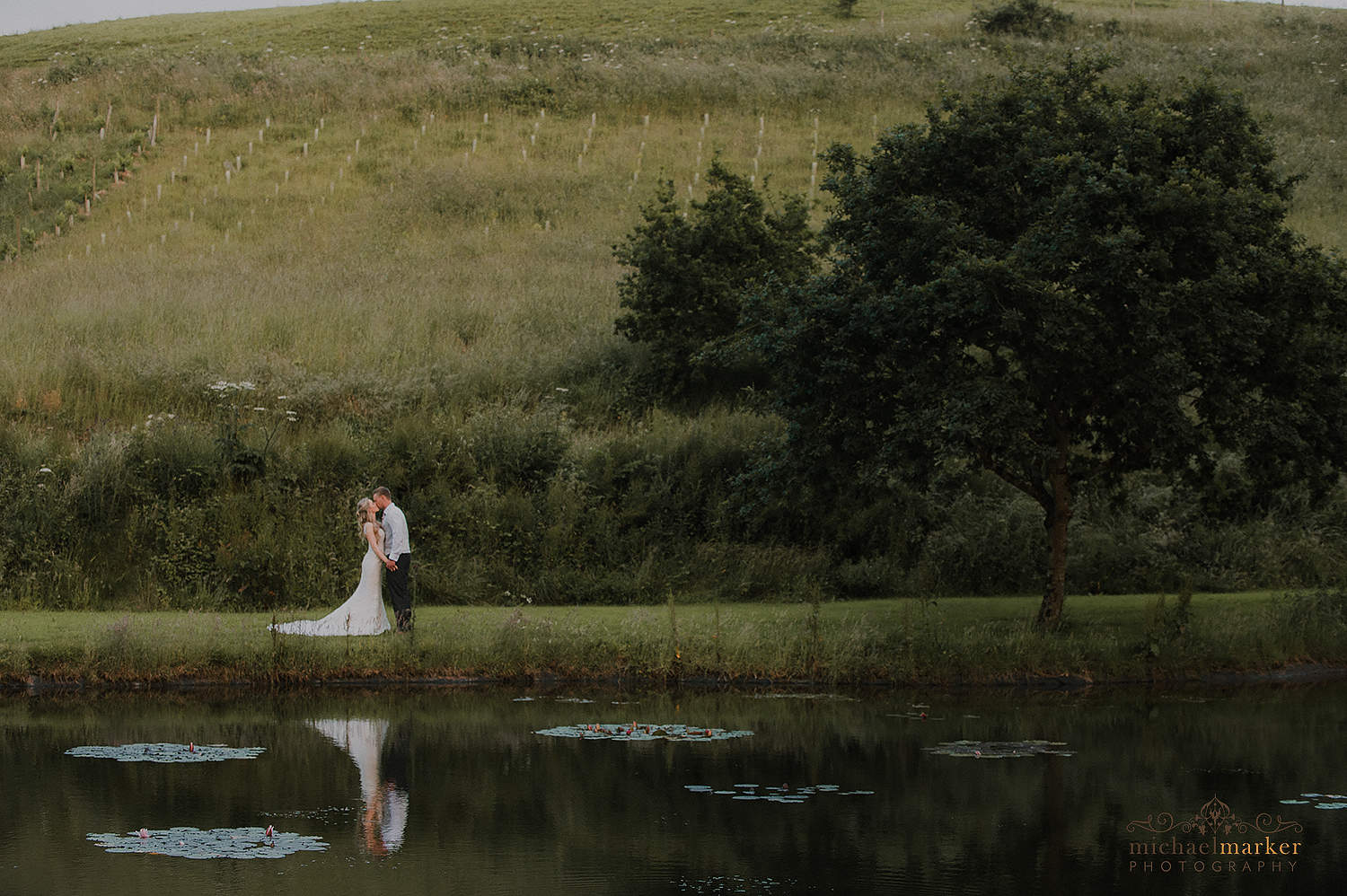 lakeside wedding kiss