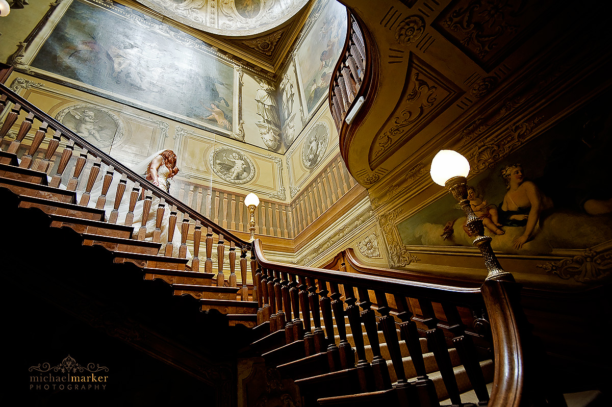 weddign couple on the main staircase at Moor Park  in London