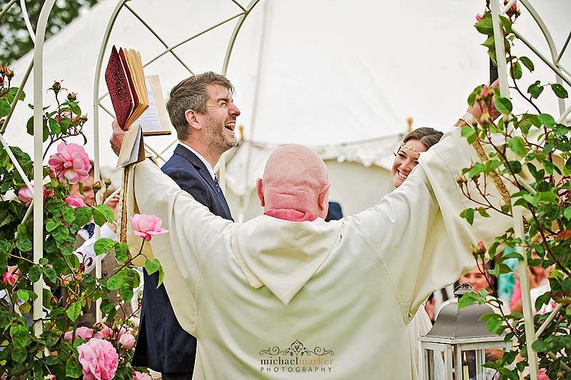 Vicar and groom celebrate wedding vows at Devon outdoor wedding