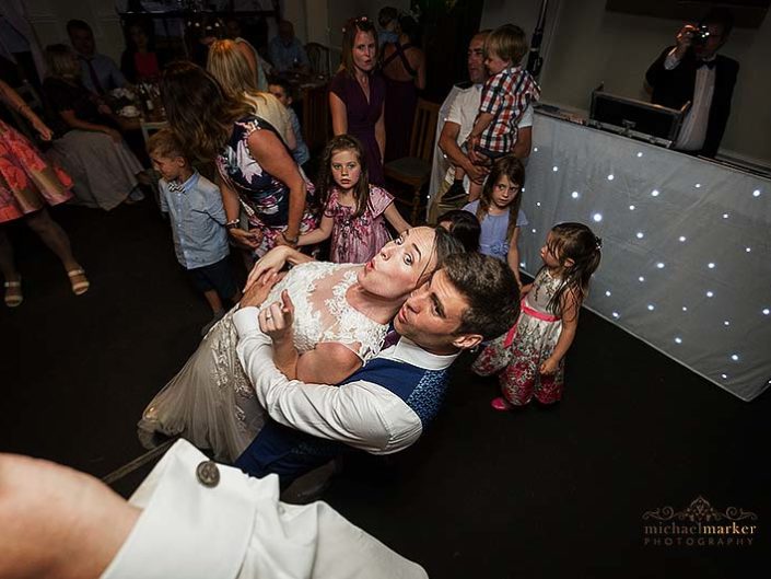 Bride and groom celebrate on the dancefloor at wedding in Salisbury