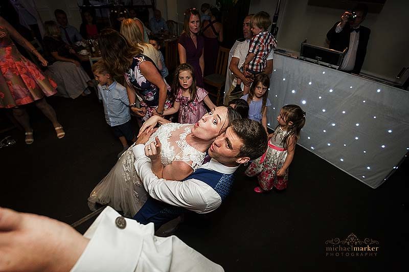 Bride and groom celebrate on the dancefloor at wedding in Salisbury