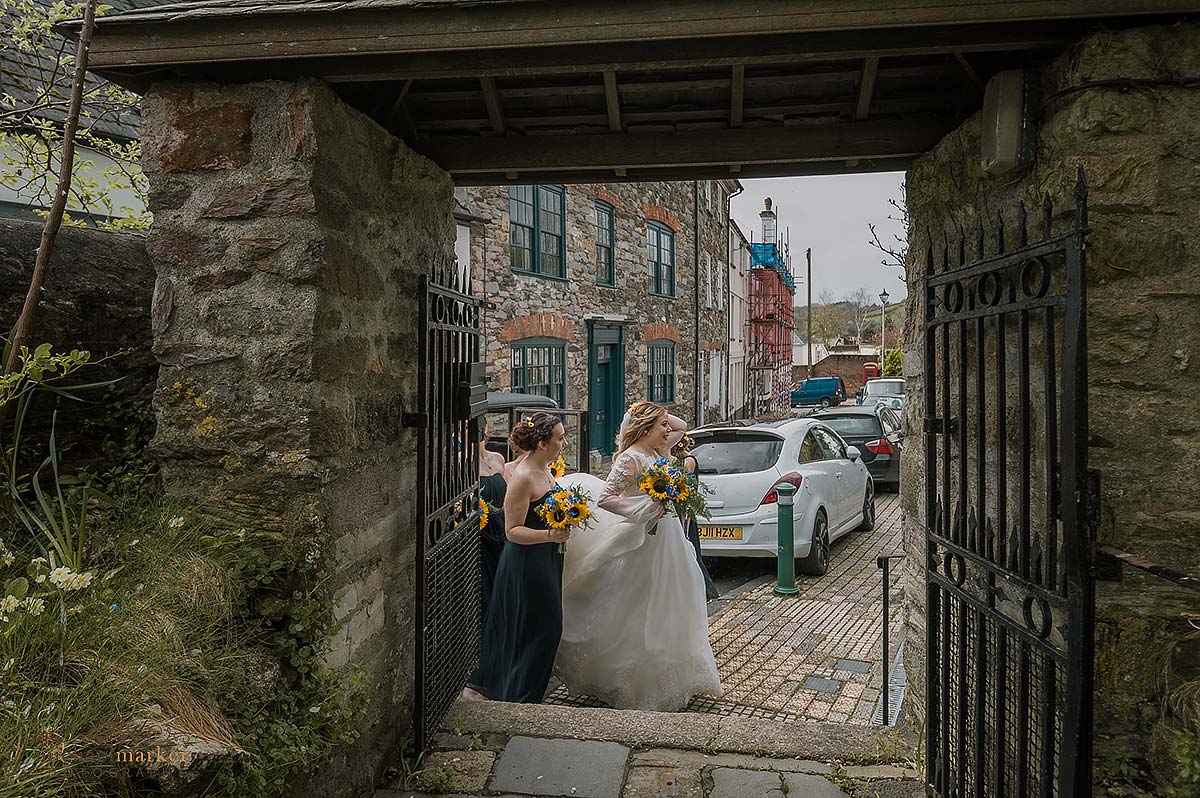 Bride and bridesmaids arrive at plympton Church in devon.