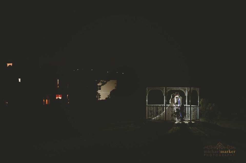 Night time wedding kiss in Gazebo at St Elizabeth's House Spring wedding