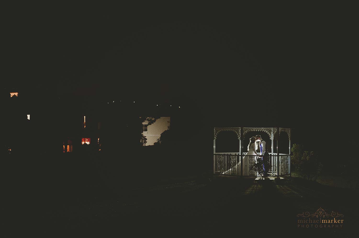 Night time wedding kiss in Gazebo at St Elizabeth's House Spring wedding