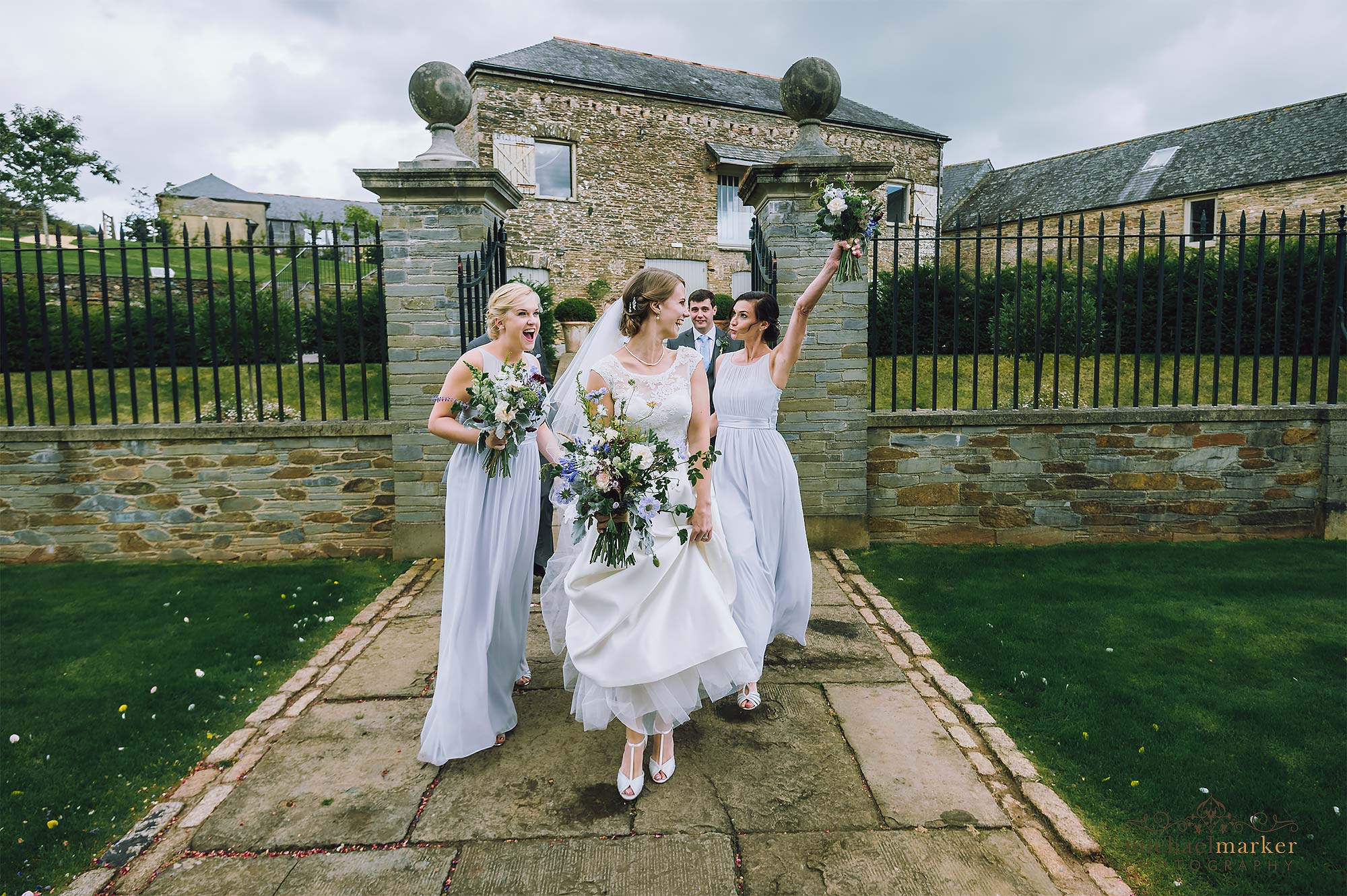 Bride and bridesmaids making an entrance at Shilstone House wedding