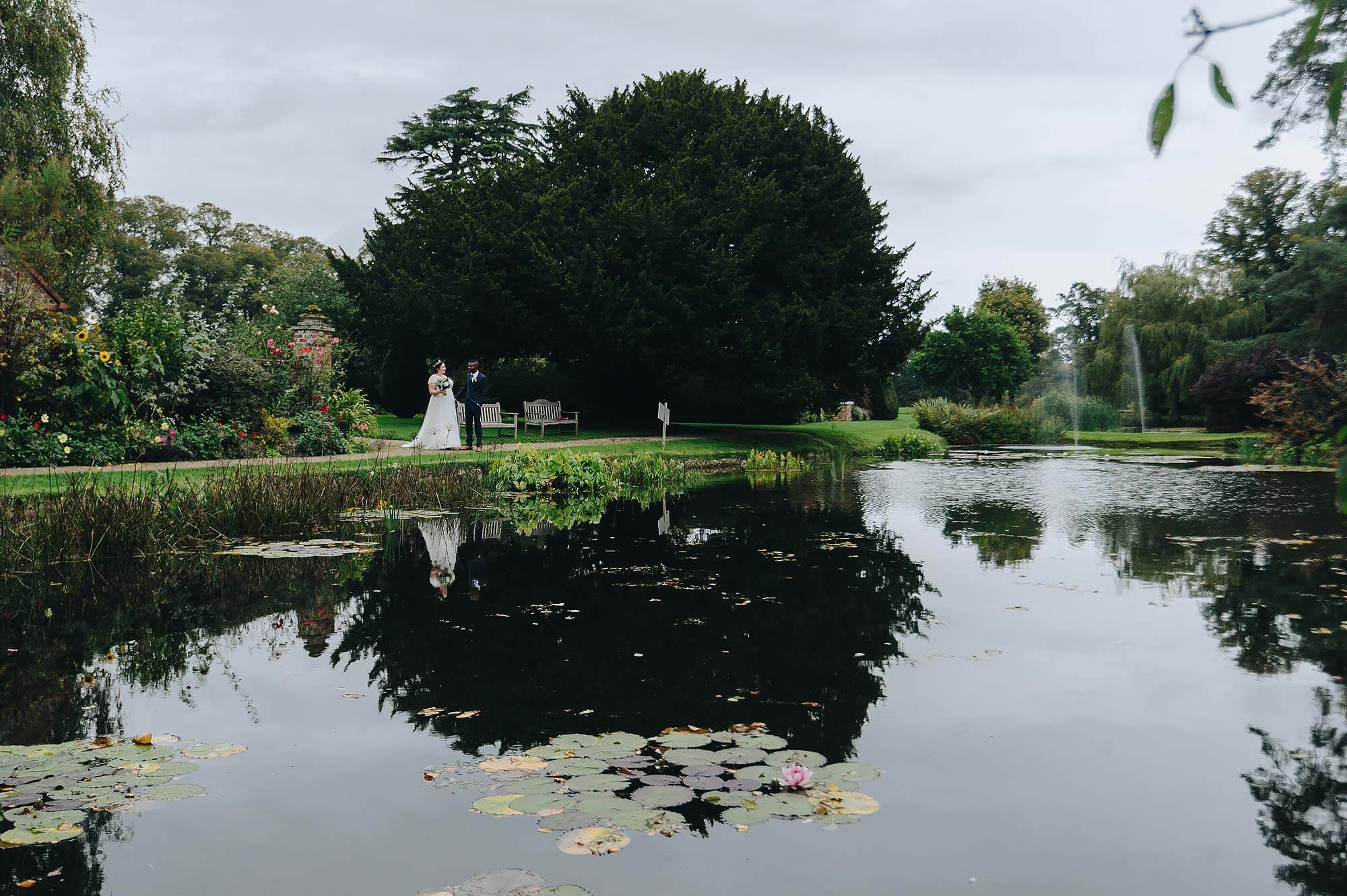 Couple at lake at Cadhay House wedding