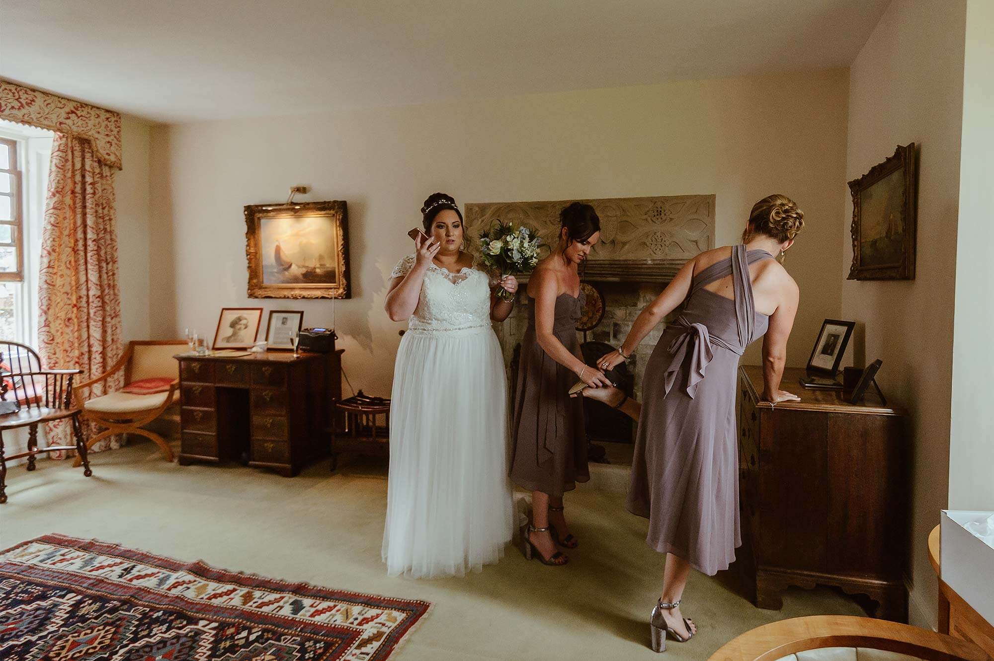 Bride and bridesmaids getting ready at Cadhay House in Devon.