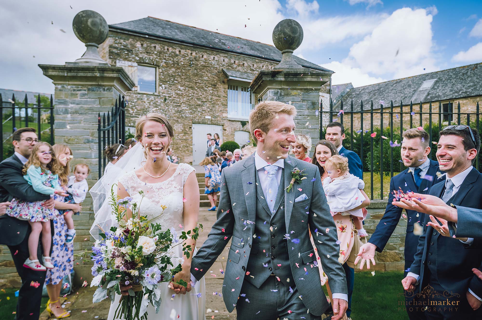 Guests throwing confetti at luxury Devon wedding venue near Plymouth called Shilstone House.