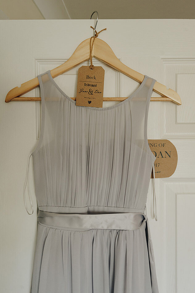 Bridesmaid dress and vintage tag hanging up