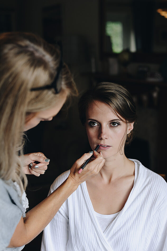 Bride having lipstick applied for Devon wedding