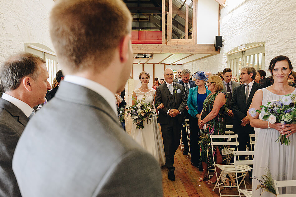 grooms first look documentary wedding photo at Shilstone House wedding